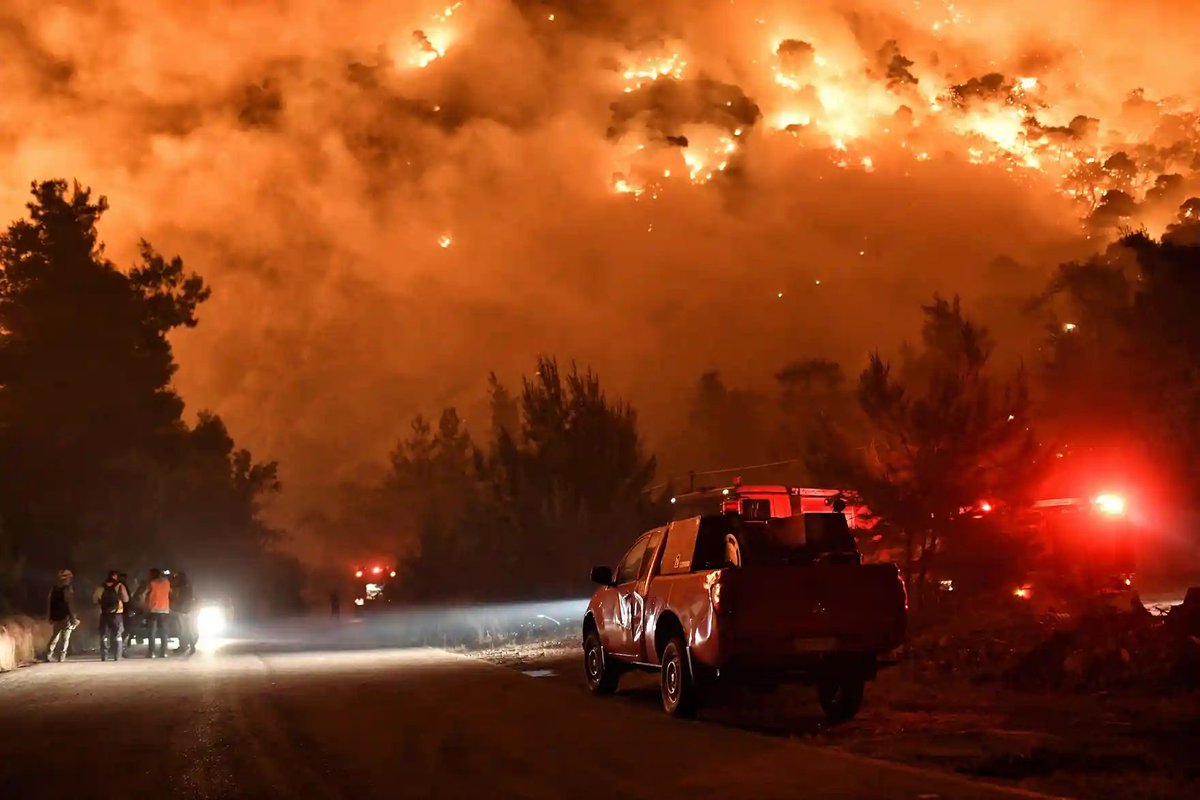 Schinos, Greece
Flames rise as firefighters and volunteers try to extinguish a fire burning in the village near Corinth in May.
Photograph: Vassilis Psomas/Reuters https://t.co/Qq4Z7L4T0x