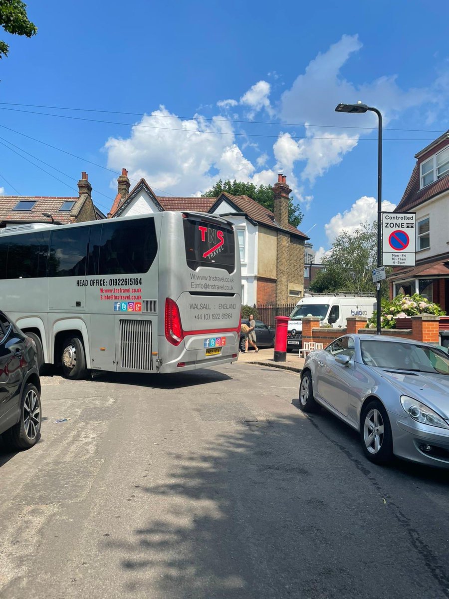 CentrAct1's tweet photo. Nightmare in #LTN25 today: @thameswater works mean large vehicles diverted WITHIN wholly unsuitable residential roads. Like this huge coach which crashed into a parked car & caused 30 mins delay on only exit road. Shouldnt @EalingCouncil @_petermason suspend #LTN25? https://t.co/9kwwg5Zu07