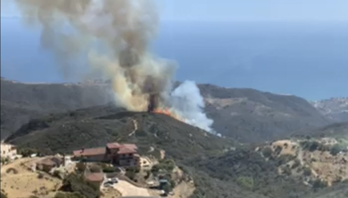 LACoFireAirOps's tweet photo. BRUSH FIRE 7/19/21 @LACoFireAirOps water dropping helicopters are assisting @LACoFD with a second alarm wildfire off Tuna Canyon Road near Las Flores Heights and Topanga. Follow @LACoFDPIO for updates. #FloresFire https://t.co/XBmmTM1GXW