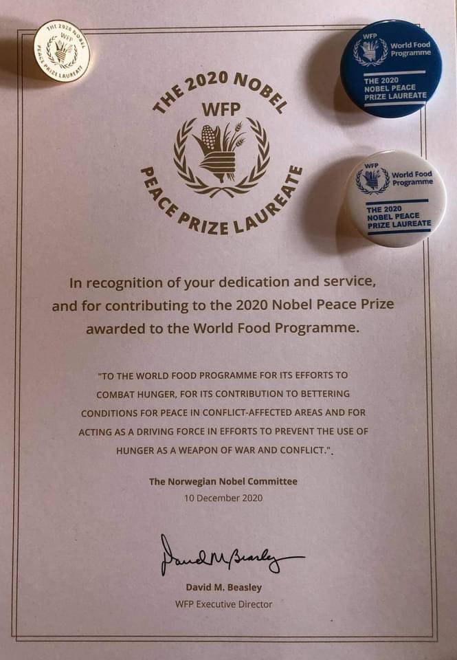 Liudageng's tweet photo. My pencil portrait with @WFP pin. The pin and certificate were  handed out last week at 1st staff meeting after March lockdown #Dili in recognition of staff service and contribution to the 2020 Nobel Peace Prize awarded to WFP. https://t.co/j9kuLFCJlf