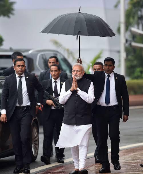 Siddharth on X: For 7 years, someone else had to hold the umbrella for  Prime Minister Modi. Yesterday he held it by himself. This might just be  his biggest personal achivement and