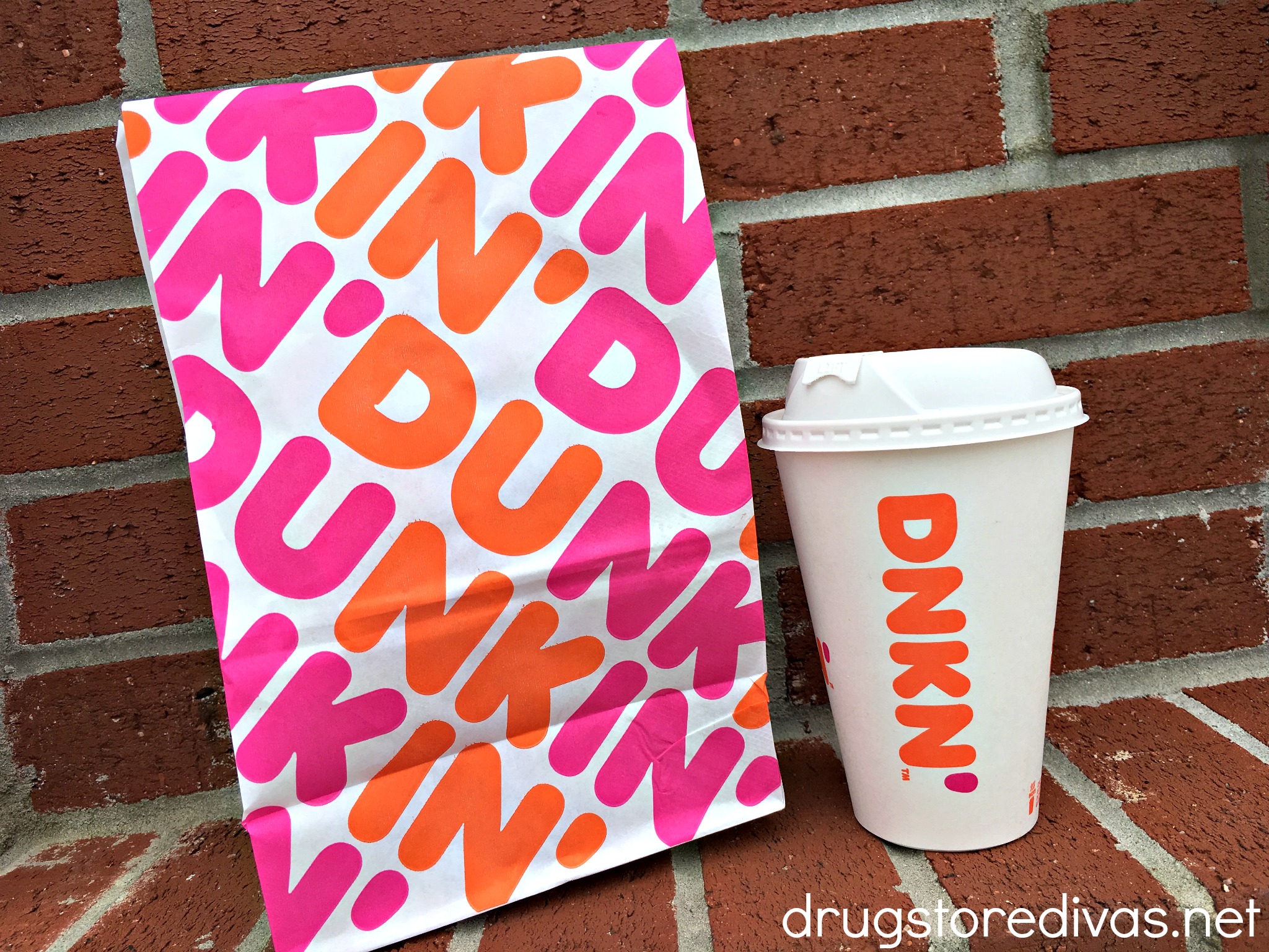 A Dunkin' bag and coffee cup.