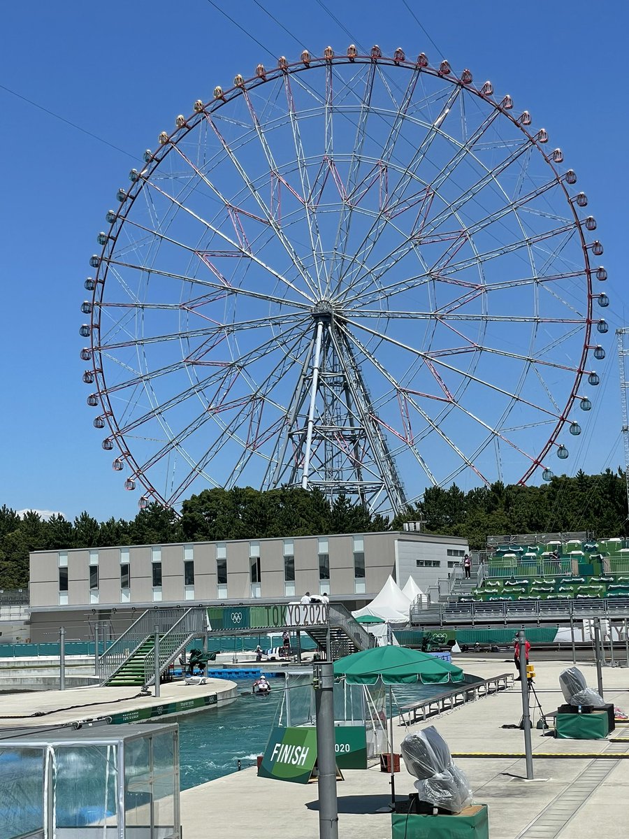 The beautifully-named Diamond and Flower Ferris Wheel turns high above the Kasai Canoe Slalom Centre finish line.  #tokyo2020