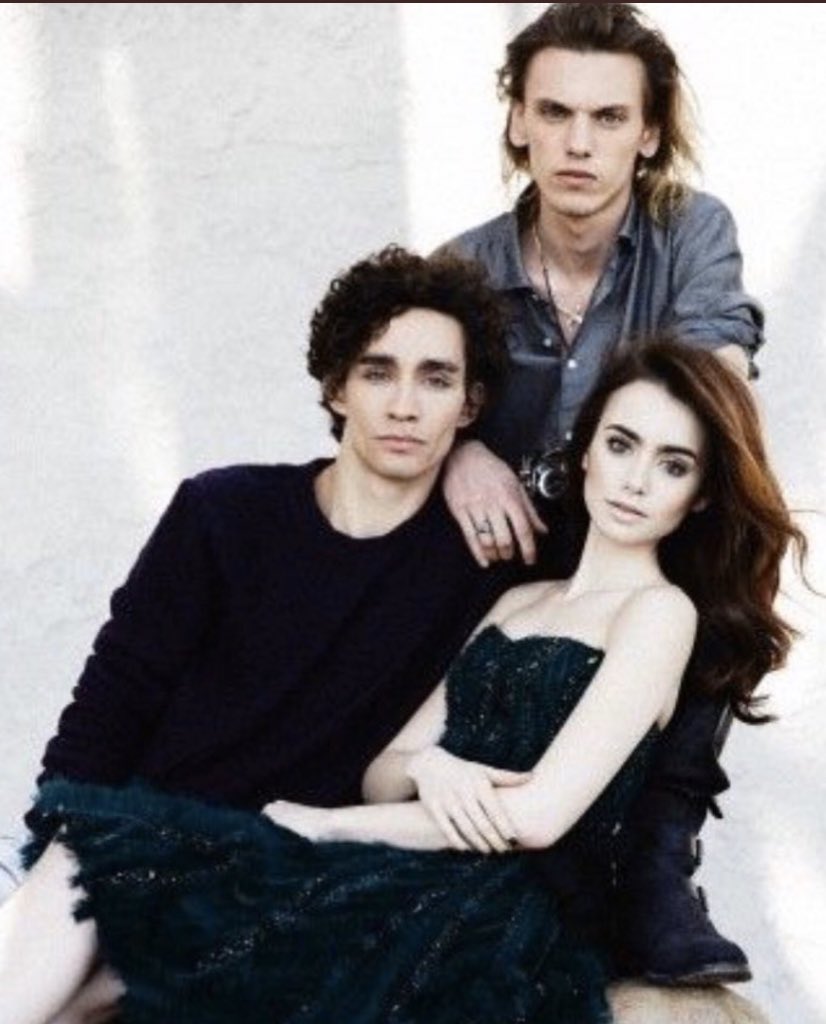 TheSheehab's tweet photo. Robert Sheehan Lily Collins and Jamie Campbell Bower photographed by John Russo in 2013 for The Mortal Instruments. All three are filming new seasons for Netflix shows - The Umbrella Academy S3 (Rob) Emily in Paris S2 (Lily) and Stranger Things S4 (Jamie)  © J Russo https://t.co/6eaVlxDkoC