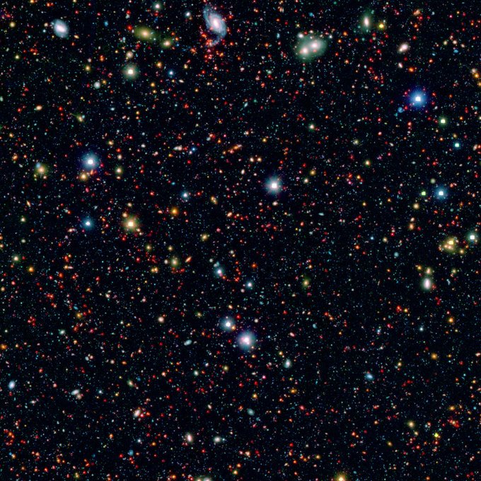 The picture is a combination of infrared data from Spitzer (red) and visible-light data (blue and green) from Japan's Subaru telescope atop Mauna Kea in Hawaii. These data were taken as part of the SPLASH (Spitzer large area survey with Hyper-Suprime-Cam) project. Image Credit: NASA/JPL-Caltech