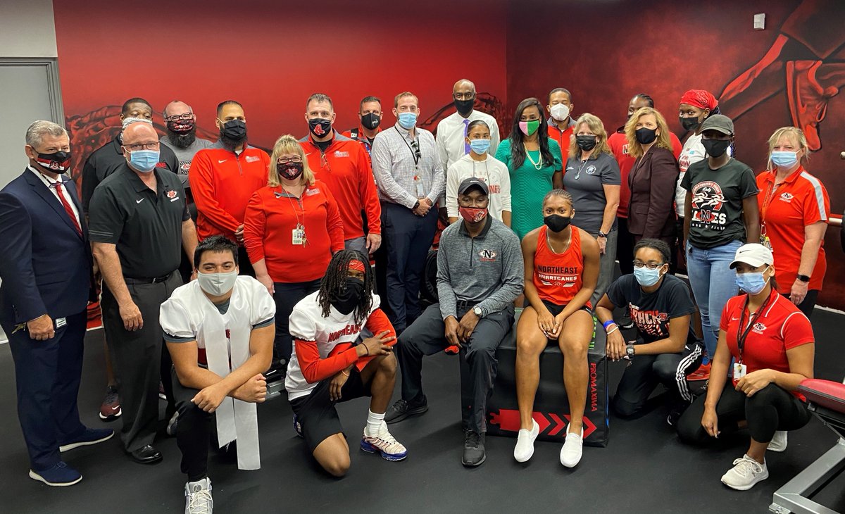 Photo of Northeast High School's new weight room during a grand opening celebration.