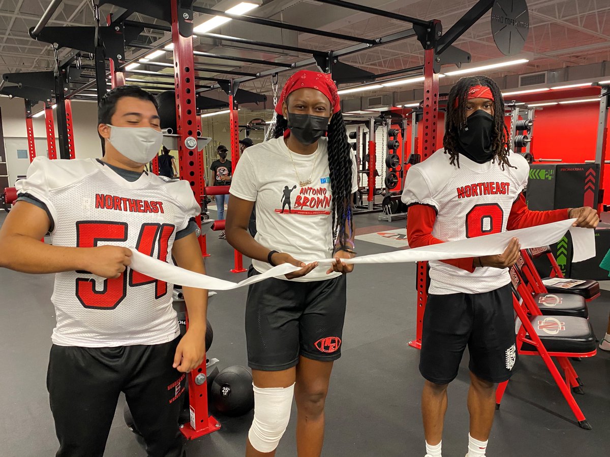 Photo of Northeast High School's new weight room during a grand opening celebration.