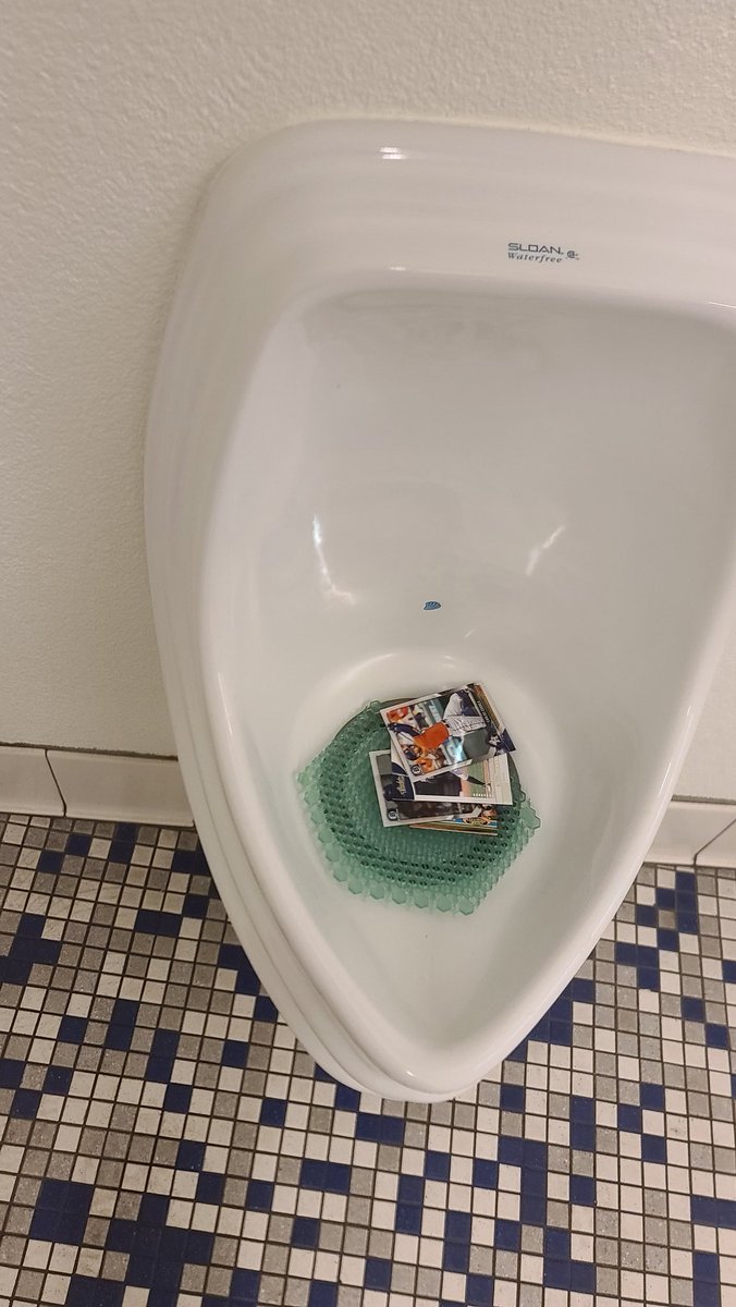 RamsesL's tweet photo. Someone put Astro baseball cards inside the Dodger Stadium urinals. https://t.co/kGn3dgovtx