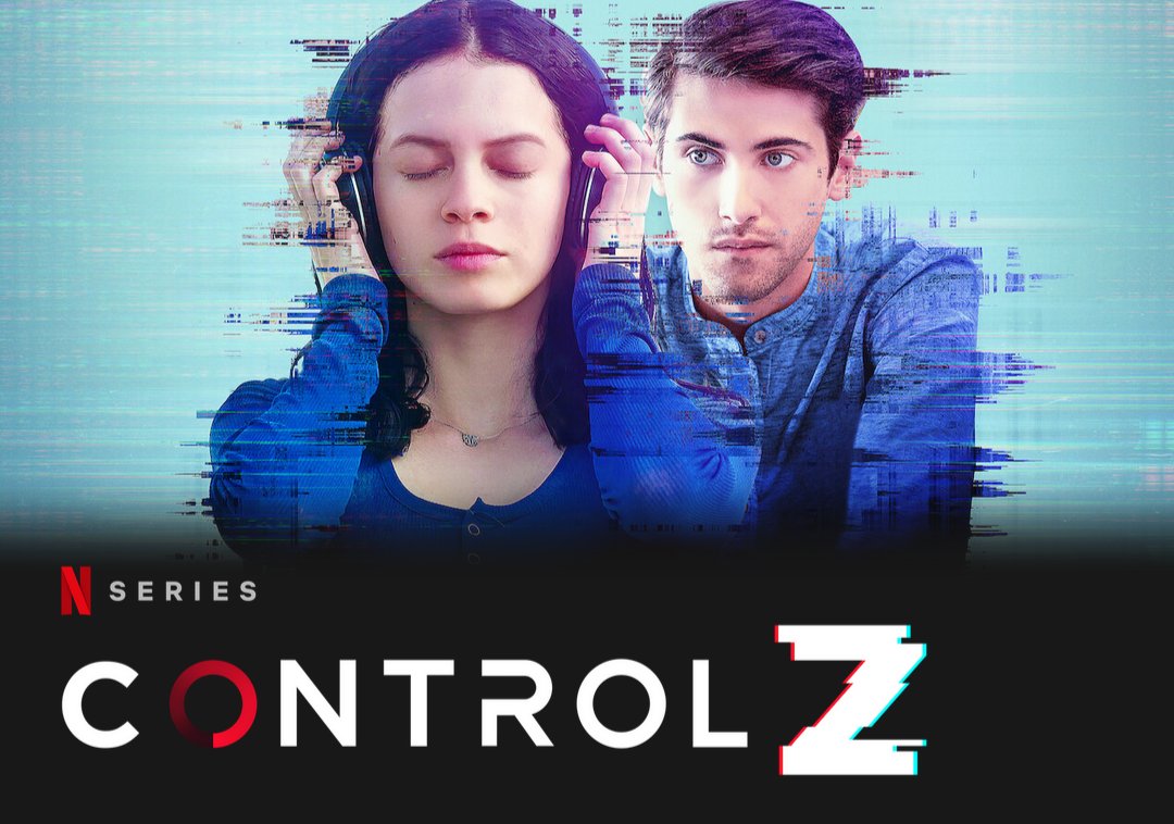 A girl is in the foreground with her eyes closed, holding headphones over her ears, absorbed in their music. A boy is in the background over her shoulder staring at her with a serious expression. It is uncertain whether he is menacing or not. Text in photo. N Series Control Z