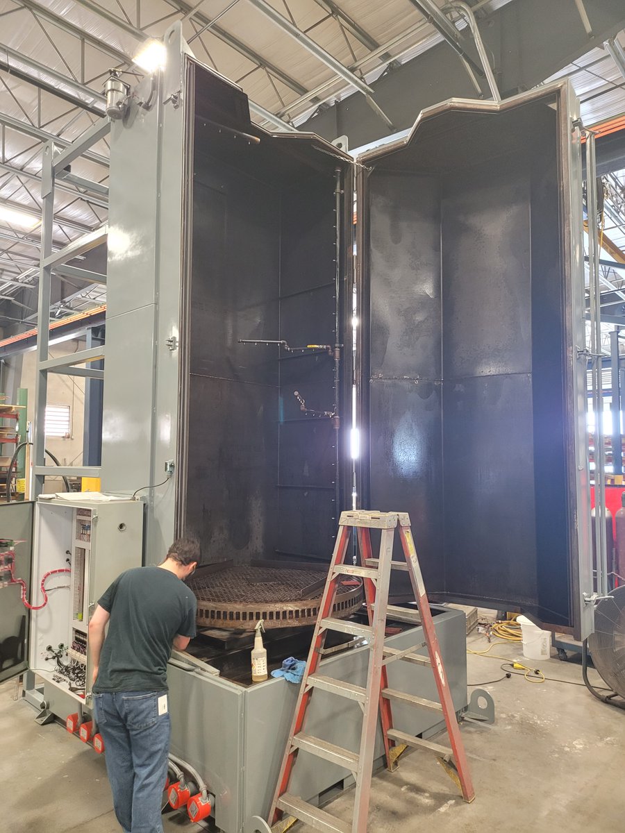 JENFAB_Inc's tweet photo. We do love to build them big! This gigantic heavy duty cabinet washer stands in at over 16.6', has a 10,000 lb. weight capacity, and is designed to be tipped over and shipped on its back - you can see the framework on the back! #partscleaning #remanufacturing #heavymachinery https://t.co/W7wL1YlVGZ