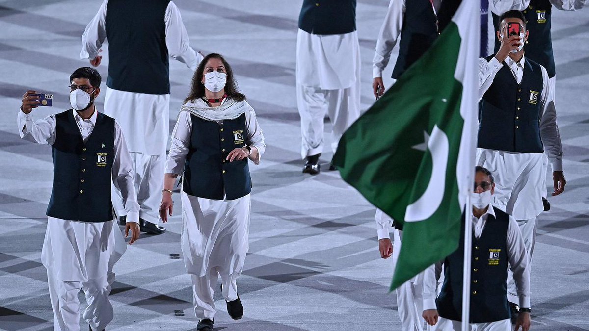 laalshah's tweet photo. That's my older sister marching at the Olympics (with white mask). She is the manager of the swim contingent. Again, so very very proud of her. https://t.co/RFvWrQKcsI