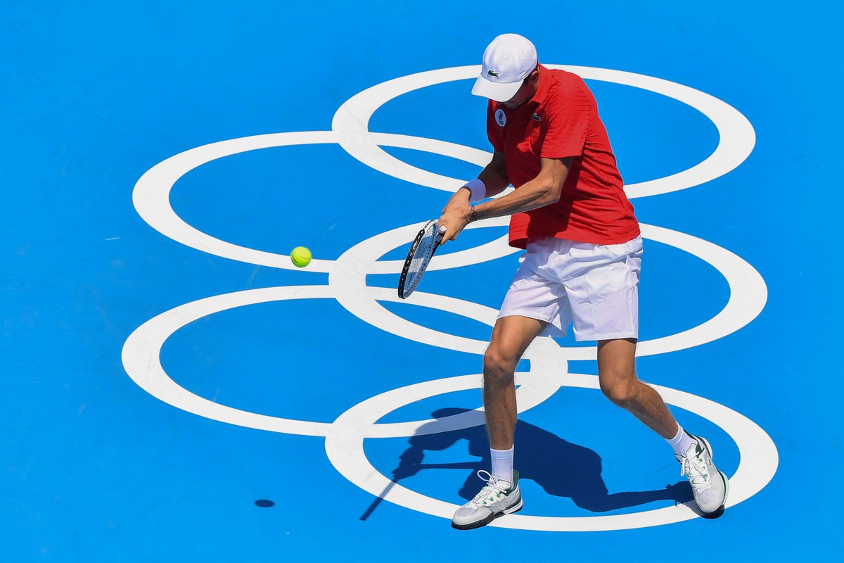 Russia's Daniil Medvedev returns a shot to Kazakhstan's Alexander Bublik during their Tokyo 2020 Olympic Games men's singles first round tennis match at the Ariake Tennis Park in Tokyo on July 24, 2021. 