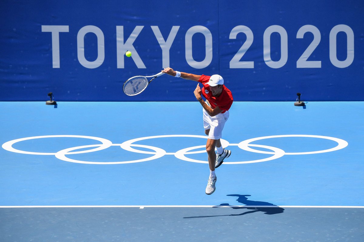 Russia's Daniil Medvedev serves to Kazakhstan's Alexander Bublik during their Tokyo 2020 Olympic Games men's singles first round tennis match at the Ariake Tennis Park in Tokyo on July 24, 2021. 