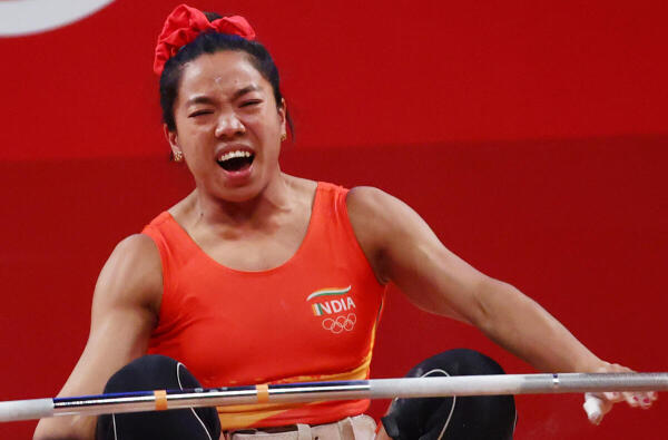 the_hindu's tweet photo. JUST IN: Could not have asked for a happier start to #TokyoOlympics , India elated by #MirabaiChanu 's silver medal win in weightlifting, says PM Modi. 
Photo: Reuters https://t.co/Mk2g0inh4o