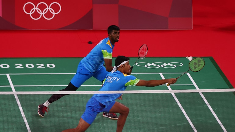 WeAreTeamIndia's tweet photo. #TeamIndia  | #Tokyo2020 | #Badminton 
Men's Doubles Group A Results

@Shettychirag04 &amp; @satwiksairaj made an amazing comeback earlier today, having defeated World No. 3 Chinese Taipei pair of Lee Yang and Wang Chi. What an #Olympics debut it was👏 #EkIndiaTeamIndia #Cheer4India https://t.co/NYbduZ4JLh