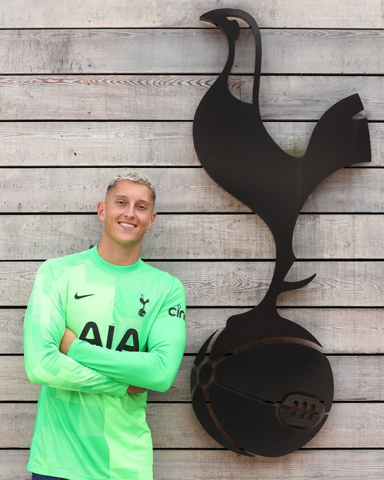 Pierluigi Gollini poses next to the Spurs cockerel