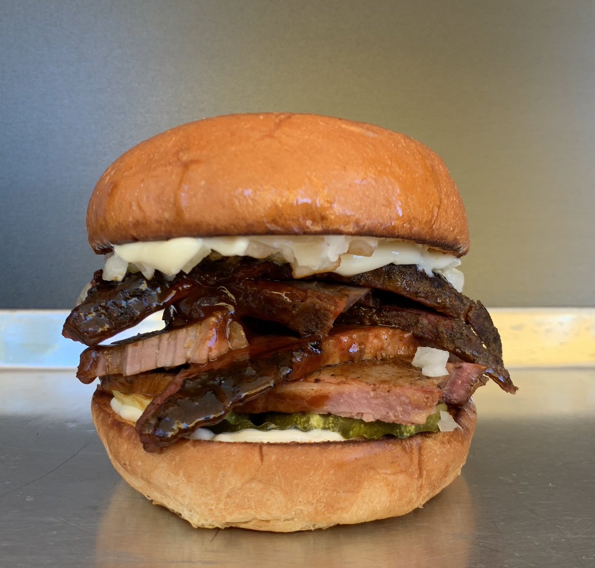 🍖Don’t risk it, get over here for some Brisket! One week remains! House smoked Brisket, BBQ, Chopped Onions, Mayo&amp; Pickles on a Toasted Bun! 🍖