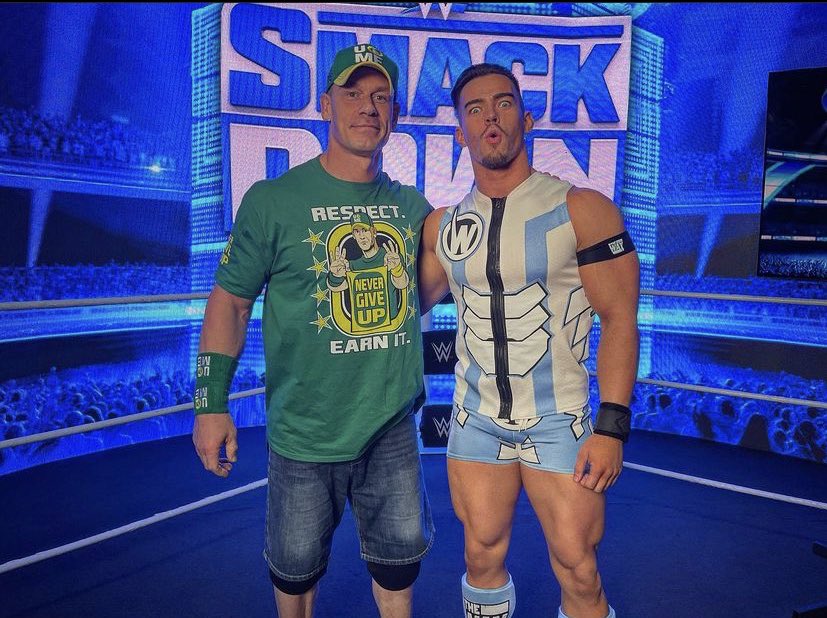 PredictABigBang's tweet photo. No, this isn’t a photo of me by myself. John Cena is literally right there, can’t you see him? You guys don’t know how special this photo-up is to me. I finally got to meet my childhood hero. My youngster years, I pretended to be John Cena even broke my neighbor’s arm… worth it. https://t.co/Fq4SskF7q6