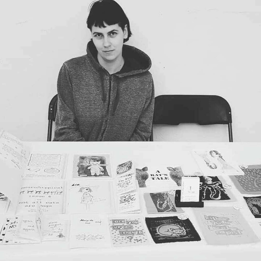 QueerZest's tweet image. Today&apos;s tabler is Lex who uses pronouns they/them. @6aiws 
.
Lex creates zines under the alias AIWS. Originally from Lithuania, now they live in Berlin with their rescue animal testing survivor dog Ragis. They are an artist and zine maker and most of the… instagr.am/p/CRwmofXreeB/
