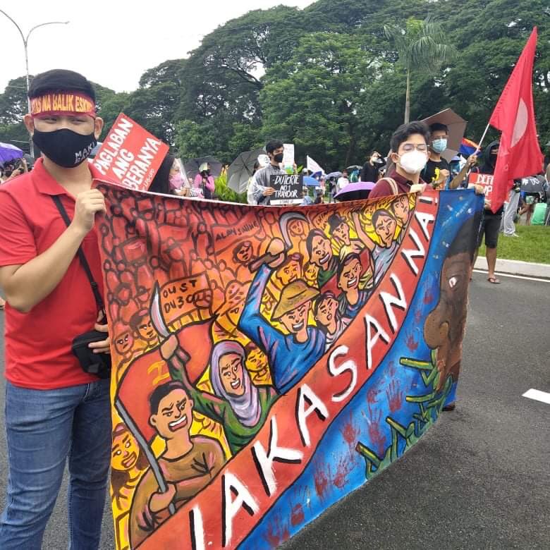 TODAY IN PHOTOS: Militant organizations mass up at University Avenue, UP Diliman to protest Duterte’s final State of the Nation Address. #DuterteWakasanNa #DuterteSONA2021 #WakaSONA