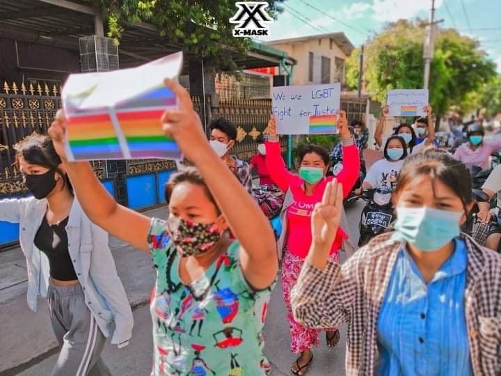 TostevinM's tweet photo. LGBT campaigners and monks among protesters on another day of demonstrations against army rule in Myanmar, preserving the hope that one day everything will be OK #WhatsHappeningInMyanmar https://t.co/hK4BnbxUja