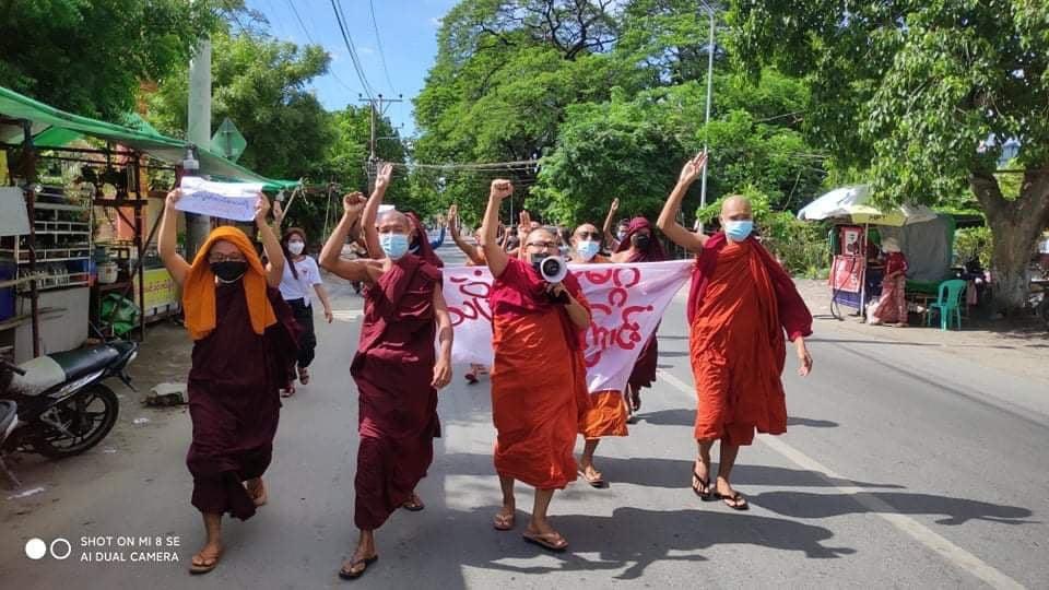 TostevinM's tweet photo. LGBT campaigners and monks among protesters on another day of demonstrations against army rule in Myanmar, preserving the hope that one day everything will be OK #WhatsHappeningInMyanmar https://t.co/hK4BnbxUja