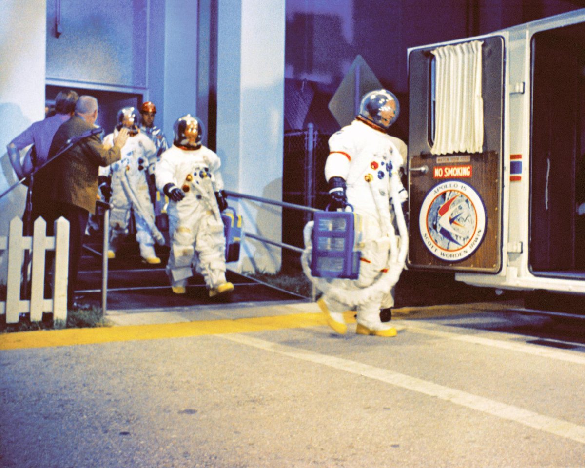 The Apollo 15 crew walks out of the Operations and Checkout Building at NASA's Kennedy Space Center