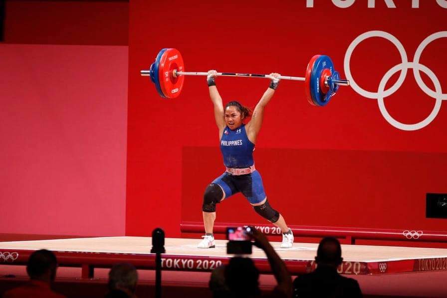 zekemartinx's tweet photo. Never forget the time Hidilyn Diaz begged for sponsorship to support her needs. Now, look at her bragging the first gold medal for the Philippines!!! 👏🏻👏🏻✨ A woman. Dedicated to her sports. She is indeed the moment. Congratulations, Miss Hidilyn! We are proud of you. MABUHAY KA! https://t.co/dShNC71VLE