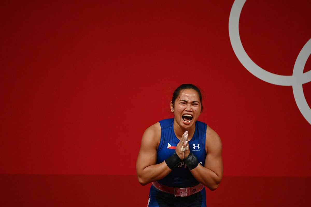 PhilippineStar's tweet image. FIRST-EVER OLYMPIC GOLD MEDAL 🥇

The Philippines gets its first Olympic gold medal since our first participation in 1924 after Hidilyn Diaz wins in the Weightlifting Women's 55kg! (AFP photos) | @nelbeltran