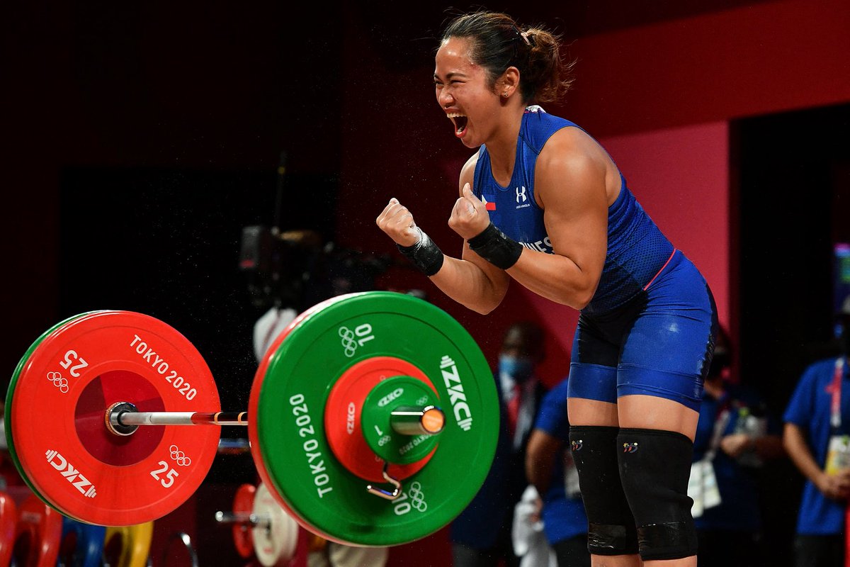 PhilippineStar's tweet image. FIRST-EVER OLYMPIC GOLD MEDAL 🥇

The Philippines gets its first Olympic gold medal since our first participation in 1924 after Hidilyn Diaz wins in the Weightlifting Women's 55kg! (AFP photos) | @nelbeltran