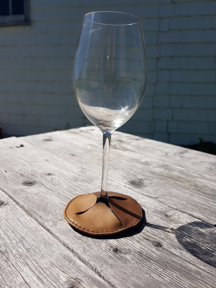 Brilliant idea!Your #wine glass will always land on the #coaster because it is attached! Be free to roam with a Wine Glass #Cozy! #reclaimedleather #recycled #madeinnovascotia #localartist @visitnovascotia #handmade sygleatherdesigns.Available @HagsOnTheHill1