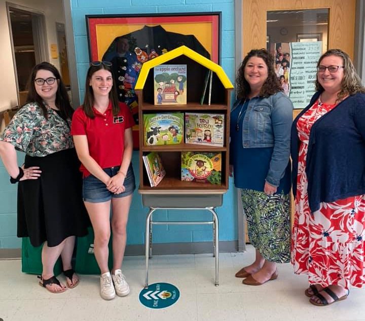 Thanks @DEFarmBureau Promotion and Education committee for the handmade barn shaped bookcase and books for @KeeneElementary 📚📚