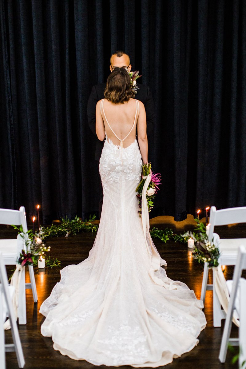 Reduce your #wedding ceremony altar decor for a simple look that puts the focus on you and your partner. A few key florals and candles that accentuate the natural beauty of your venue will create a budget-friendly, intimate setting.