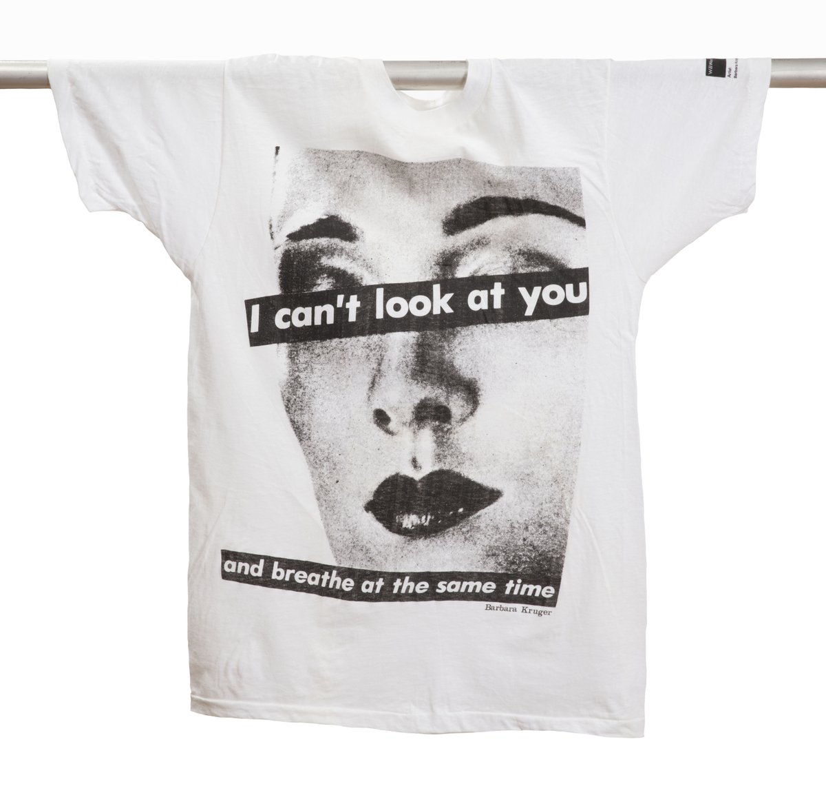 Cotton T-Shirt featuring image of an anonymous face in grayscale with the words “I can’t look at you and breathe at the same time” superimposed over the figure’s eyes and chin