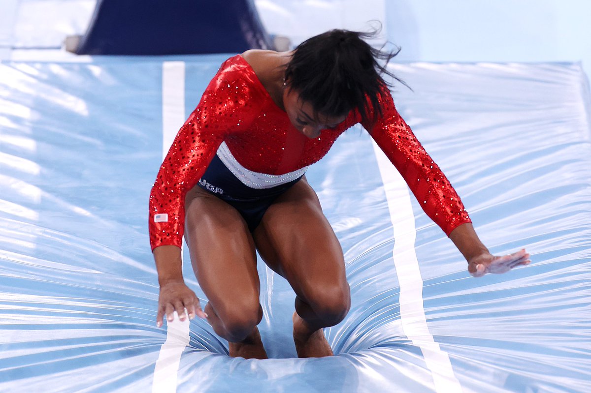 TOKYO, JAPAN - JULY 27: Simone Biles of Team United States stumbles upon landing after competing in vault during the Women's Team Final on day four of the Tokyo 2020 Olympic Games at Ariake Gymnastics Centre on July 27, 2021 in Tokyo, Japan. (Photo by Jamie Squire/Getty Images)