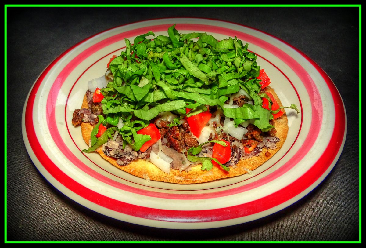 Beef, Black Olive & Refried Black Bean Tostada #dinerinmymind #homecooking #food #cookingathome #beef #blackolives #refriedbeans #blackbeans #flourtortilla #tomato #jalapenopeppers #jackcheese #lettuce #onions #cilantro #pandemiclife #cumin #garlic #shoppinglocal #farmersmarket
