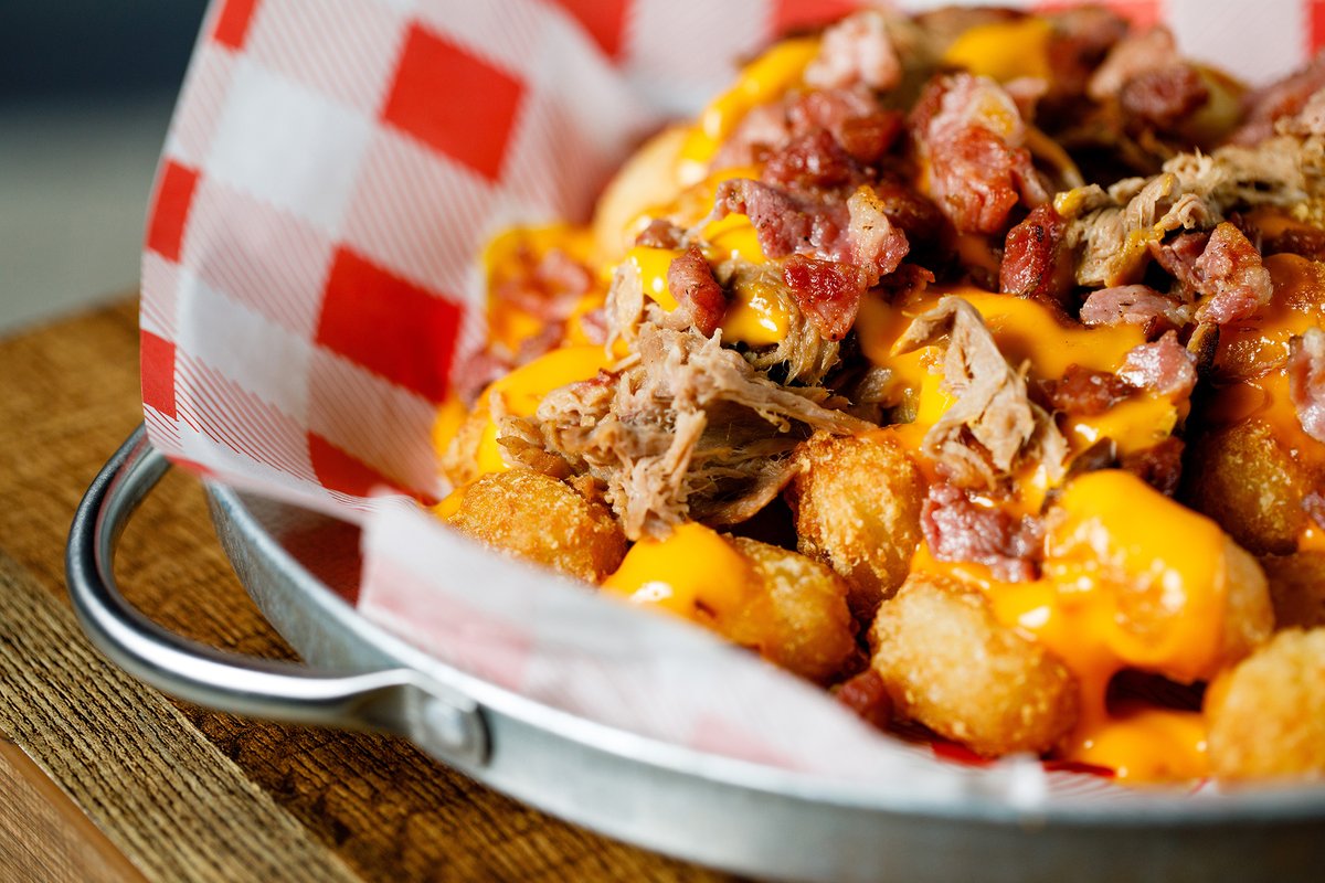 Pig Out Loaded Tater Tots - American style tater tots topped with nacho cheese, 12 hour bbq pulled pork and hickory smoked bacon 🐷 

Client: Cattle &amp; Co | Llanelli

#swansea #swanseafood #swansearestaurants #americanbbq #bbq #welshbusiness