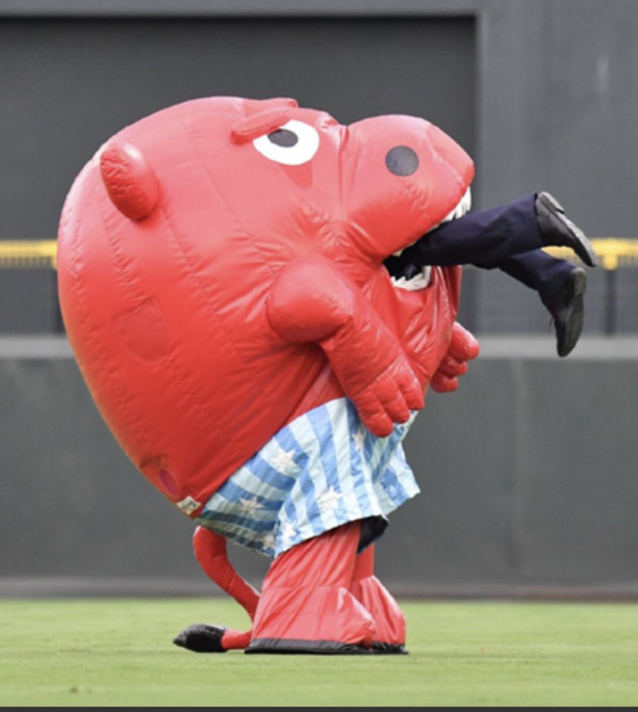 mondomascots's tweet image. A mysterious red mascot suddenly appeared today at the Hiroshima Carp vs. Nippon Ham Fighters game. When a guard tried to stop the unnamed, bull-like creature’s invasion, it swallowed him, then spat him out without his clothes.