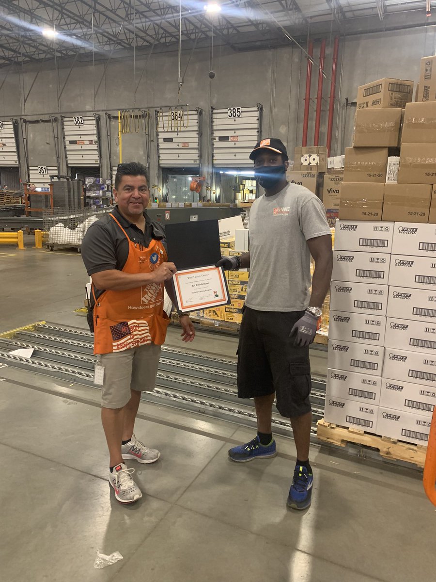 Dan recognizing Art for completion of his receiving dock cross training! Great job Art continuously signing up and learning new areas.