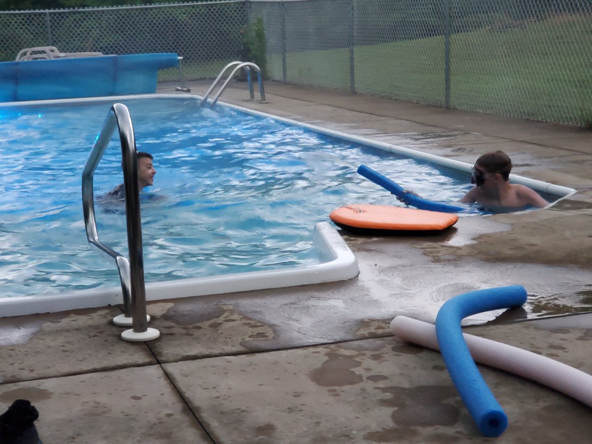 HopeEatonSmith's tweet image. When your cousin flies in for the week... you go night swimming in the rain #pooltime #stormsover #nightswimming