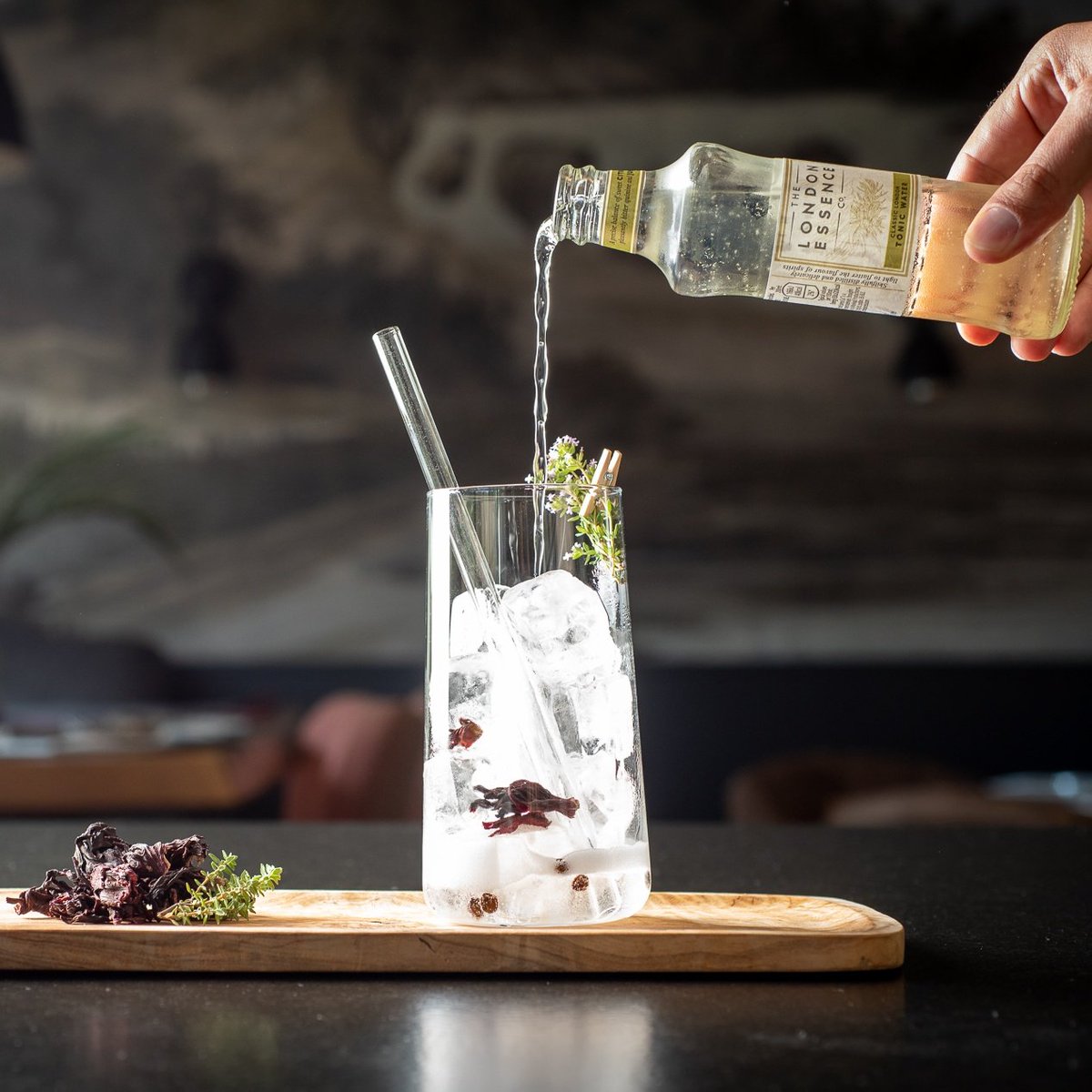 DPierreBlanche's tweet photo. What's your favorite cocktail? How about a #gintonic ? Introducing..  La Ginette. Fleurs de hibiscus and poivre, with #londonessence to finish. Fresh and sassy 😉#hotelbar https://t.co/58nSZK9dys