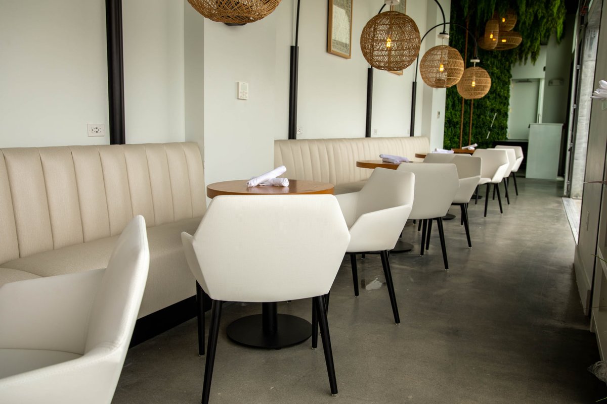 Our team created an array of comfortable, stylish furniture for Cut21 on Revere Beach. Luxurious upholstered barstools, high top booth seating with brass footrails, and curved banquettes all add to the contemporary atmosphere of this restaurant.