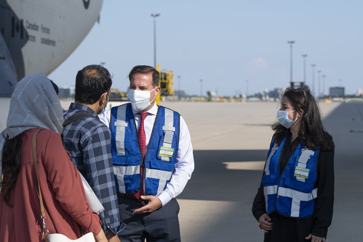 CitImmCanada's tweet photo. Today, Ministers Mendicino and Monsef welcomed the first group of Afghan refugees. They will be resettled through a special immigration program for individuals and their families who provided support to Canada’s efforts in Afghanistan. https://t.co/kzMV36z2IB