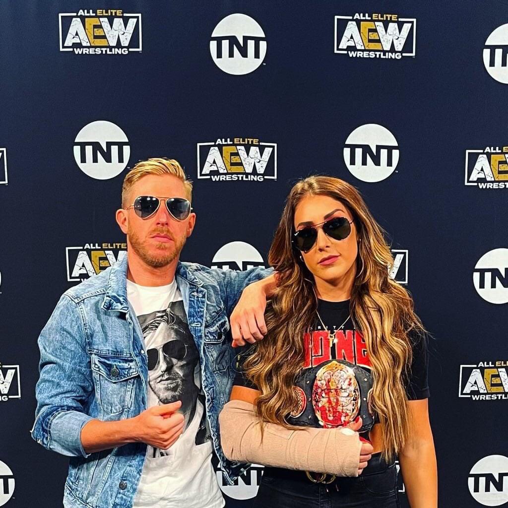 LillieDrain's tweet photo. Waiting on #AEWDynamite to start! So ready! @AEW @AEWonTNT here’s a pic of @RealBrittBaker and @orangecassidy ❤️ https://t.co/CmpkVi1Far