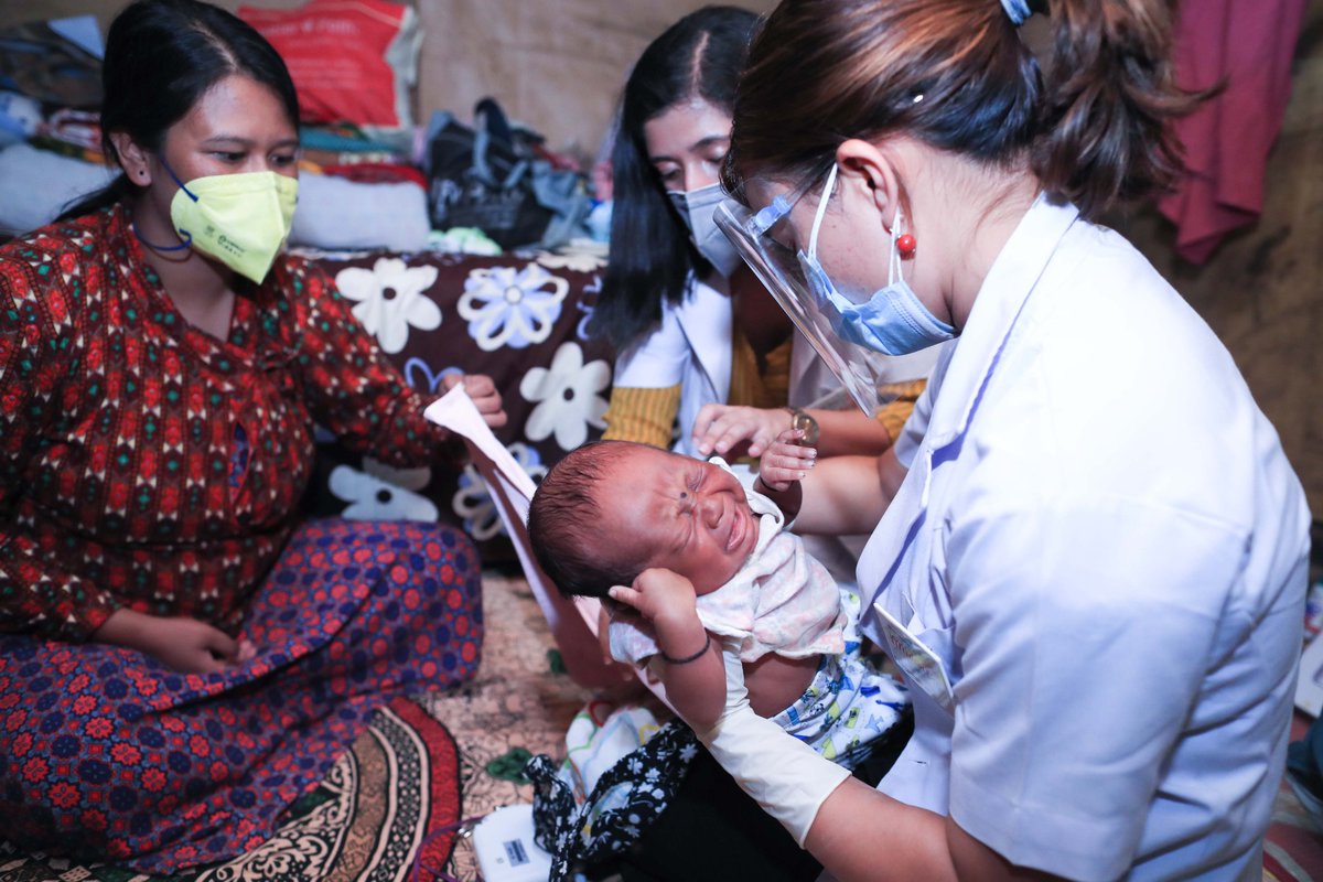Prasansa Budha Lama a registered midwife and sajana thapa magar tamang examining a new born baby. 
