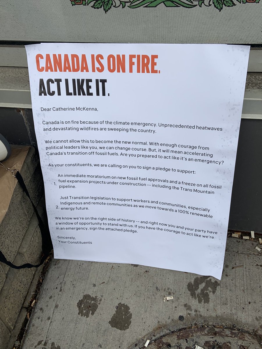 Today, we made <a href="/cathmckenna/">Catherine McKenna</a> feel the heat (in the rain) as we demanded emergency-level action on the climate crisis. #CanadaOnFire <a href="/350Canada/">350 Canada</a>
