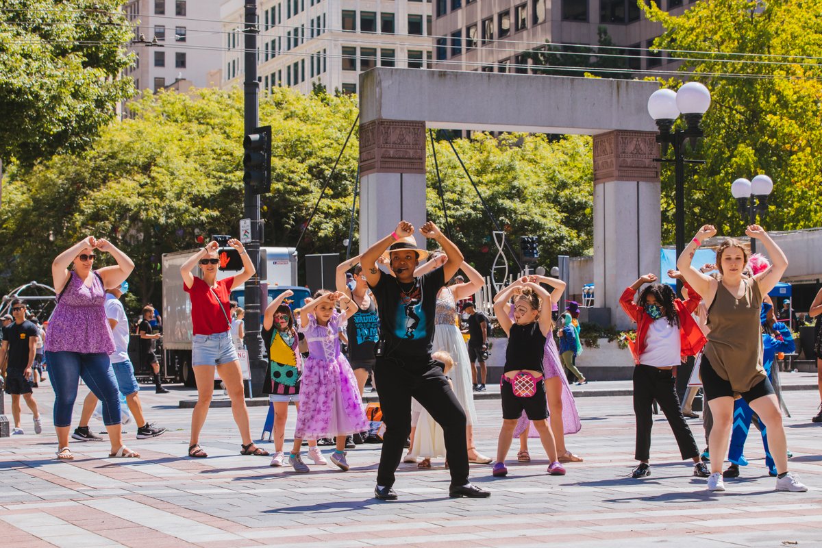 TAQUEET$ teaching the dance to "Thriller" to an audience.