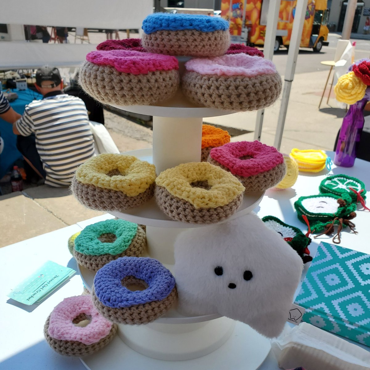 sucklet7's tweet photo. last week i helped my human's sister run a booth at a craft fair. i was a model and i climbed on the display too. it was very fun.
#sucklet #craftlet #doughnuts https://t.co/mWdVws4EcV
