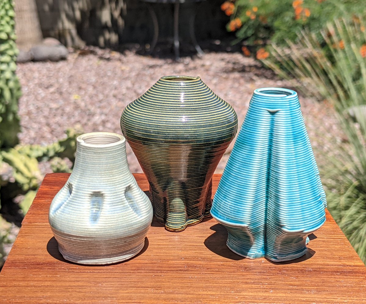 CrimsonIndustry's tweet photo. I think most of this batch turned out pretty well. I particularly like the cyan and dark green ones. Watertight, too. #3Dprinting #glaze #vase https://t.co/qhbJMp9aPY