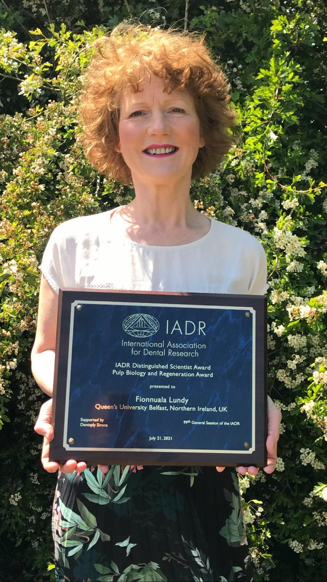 Image shows Dr Fionnuala Lundy holding her award.